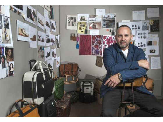 George Esquivel, shoemaker and designer, sits in front of a pin board in his studio in Buena Park. Esquivel also is the creative director for Tumi luggage, bags and accessories.   
