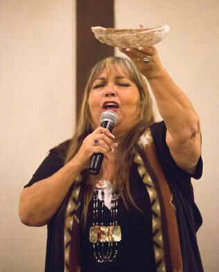 Jacque Tahuka-Nunez offers a blessing and opening prayer at the Native American Heritage Month reception on Nov. 8 at the Fullerton Marriott. (Photo courtesy of Cal State Fullerton)